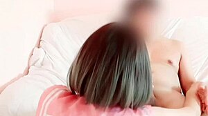 In this homemade video, a busty girl in school cosplay rides in cowgirl position, showing her trimmed pussy.