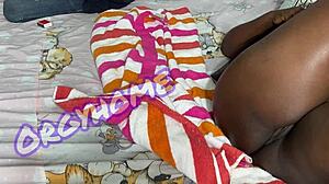 Juicy ebony housewife plays a fun game.