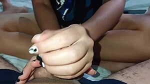 in the shadows, my wife gives a sloppy handjob to our friend