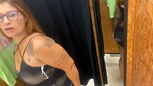 trying on clothes with buttplug in store