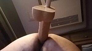 She's bent over in doggystyle, using huge dildo solo for intense pleasure in private