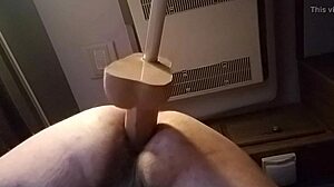 She's bent over in doggystyle, using huge dildo solo for intense pleasure in private