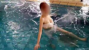 Skinny girl exercises her legs in the pool