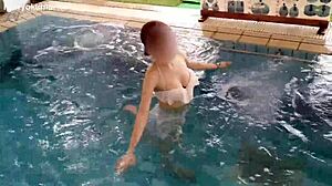 Skinny girl exercises her legs in the pool