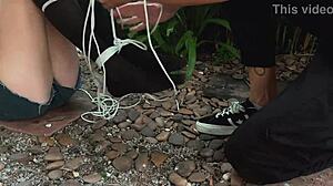 I punished her by tickling her feet outdoors