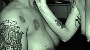 Dom dyke spits in sub stud's mouth during rough lesbian play. Tattooed queer couple gets sloppy with intense kisses.