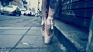 ballerina in ballet shoes walks down the street