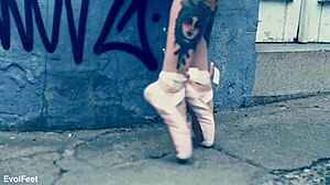 ballerina in ballet shoes walks down the street