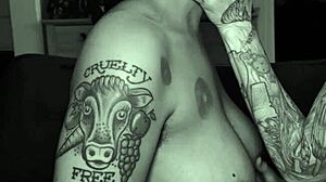 Dom dyke spits in sub stud's mouth during rough lesbian play. Tattooed queer couple gets sloppy with intense kisses.
