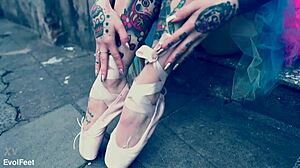 ballerina in ballet shoes walks down the street