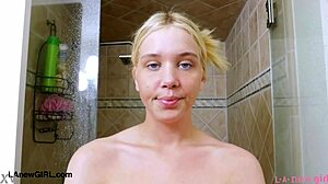 Captivating blonde model feels relaxed after photoshoot shower