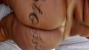 Bbw applies oil to huge tattooed ass intensely