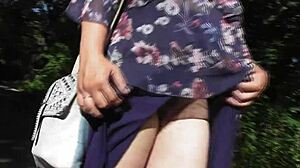 Hairy mature flashes chubby beaver in public park under skirt.