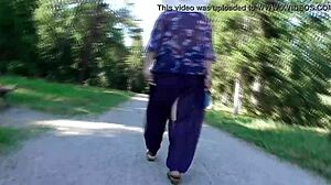 Hairy mature flashes chubby beaver in public park under skirt.