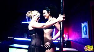 Two horny sluts watch a striptease and decide to fuck the stripper with a strapon