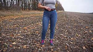 milf teasing her big cameltoe in blue jeans outdoors