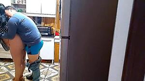 The wife cheats in the kitchen with her lover.