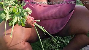 Curvy ebony believer tends to the church garden with care
