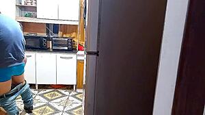 The wife cheats in the kitchen with her lover.