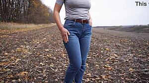 milf teasing her big cameltoe in blue jeans outdoors