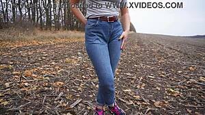 milf teasing her big cameltoe in blue jeans outdoors