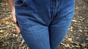 milf teasing her big cameltoe in blue jeans outdoors