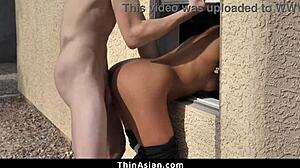 Asian delivery girl gets roughly fucked by two boys while stuck in the window!