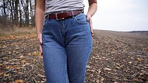milf teasing her big cameltoe in blue jeans outdoors