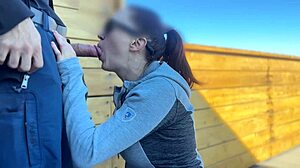 Wow, redhead slut blows big cock on roof!