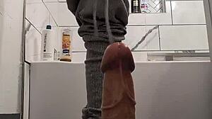 I feel my pussy stretching wide around this massive dildo pushing deeper inside