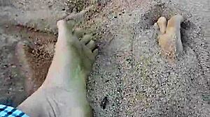 Barefoot model poses feet in the sand for nature photography
