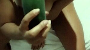 skinny girl flashes and masturbates with big cucumber
