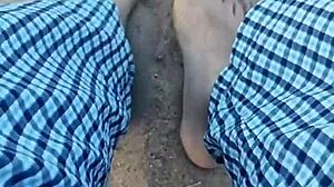 Barefoot model poses feet in the sand for nature photography