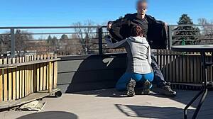 Wow, redhead slut blows big cock on roof!