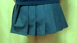 Japanese amateur plays anal in schoolgirl uniform, shorts, and see-through underwear.