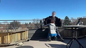 Wow, redhead slut blows big cock on roof!