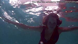REDHEAD B NIKITA VODOREZOVA GETS NAKED FAST UNDERWATER