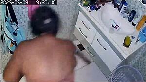 Hidden Camera Captures Busty Brazilian Neighbor Shaving Her Huge Pussy In The Bath