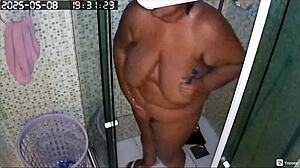 Hidden Camera Captures Busty Brazilian Neighbor Shaving Her Huge Pussy In The Bath