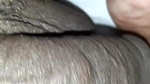 Man plays with huge black monster cock close up