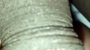 Man plays with huge black monster cock close up