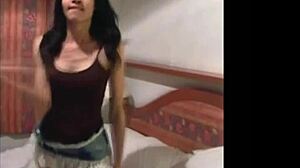 i love watching this thai ladyboy dance in a jean skirt while stripping to show her big tits