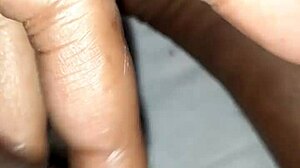 Man plays with huge black monster cock close up