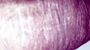 Man plays with huge black monster cock close up