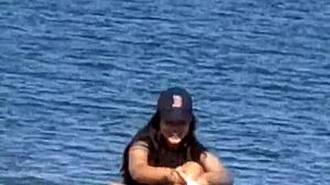 Juicy Asian Teasing on Hidden Beach Candidly