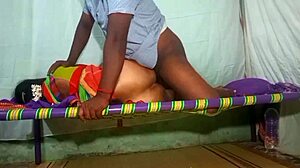 Tamil aunty in saree bends over for doggystyle action in a homemade video set in her room.