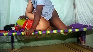 Tamil aunty in saree bends over for doggystyle action in a homemade video set in her room.