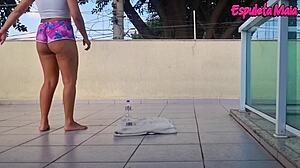 brunette trains outdoors with shorts up her ass