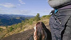 Tourist Guide Shows Something to Tourist on Mountain