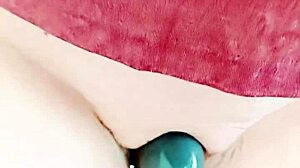 Mature cougar's big pussy lips slide and grind, wet and hairless.